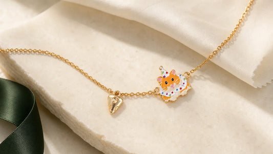 Gold enamel keepsake necklace with a soft jewelry polishing cloth