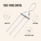 Stainless steel three-prong skewer with pointed tips, push-release slider, and loop handle