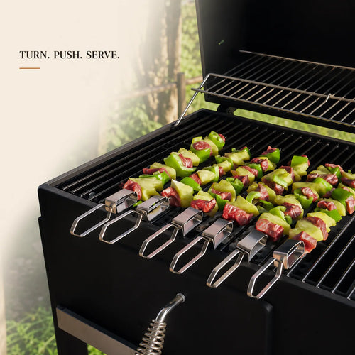 Six push-release skewers cooking meat and vegetables on an outdoor grill