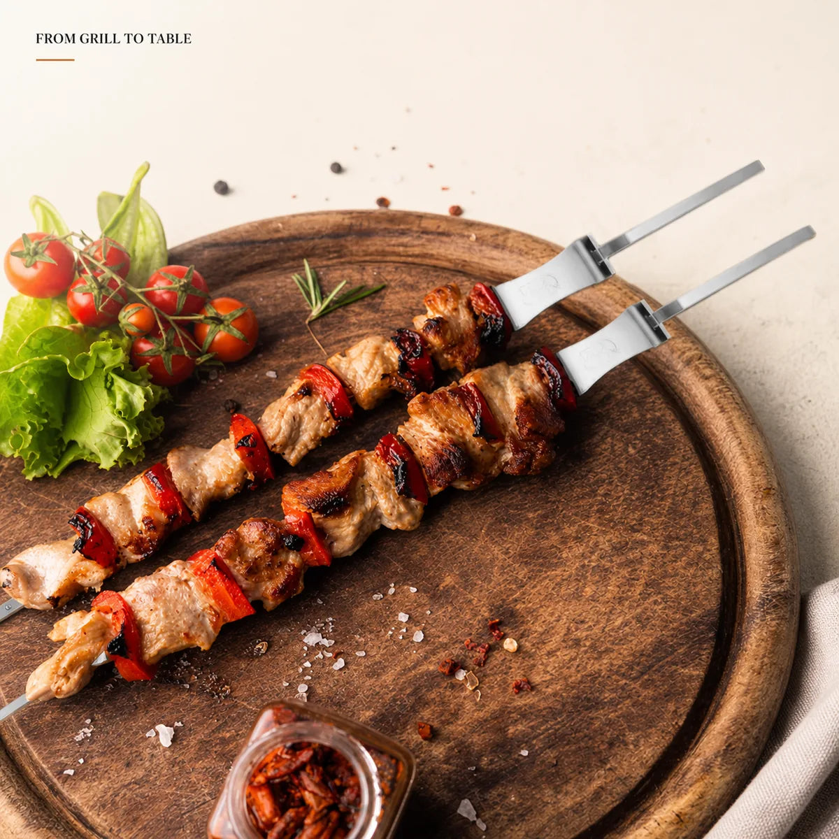Cooked meat and vegetables served on stainless steel BBQ skewers